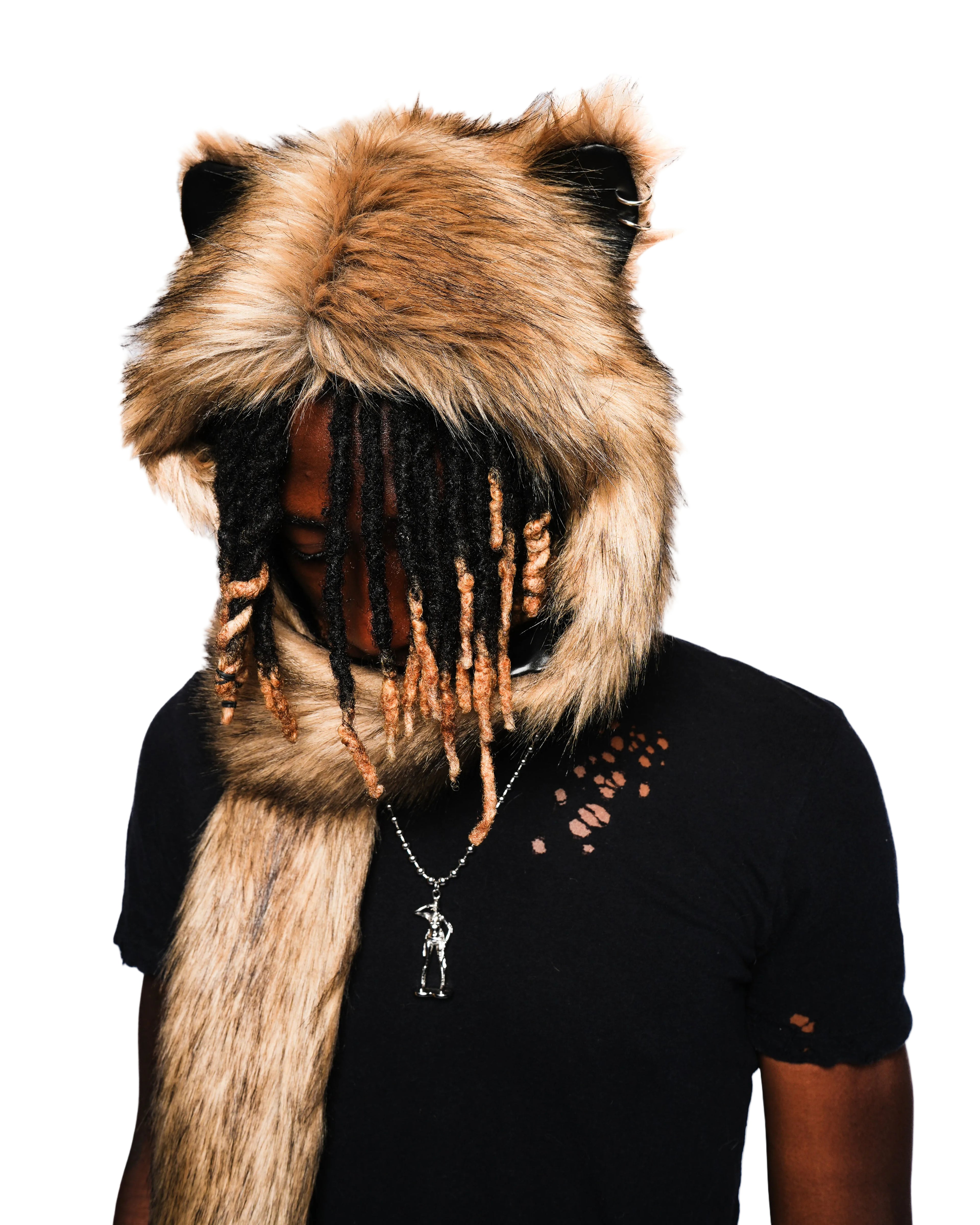 Person wearing a large fur hood with animal ears on a white background