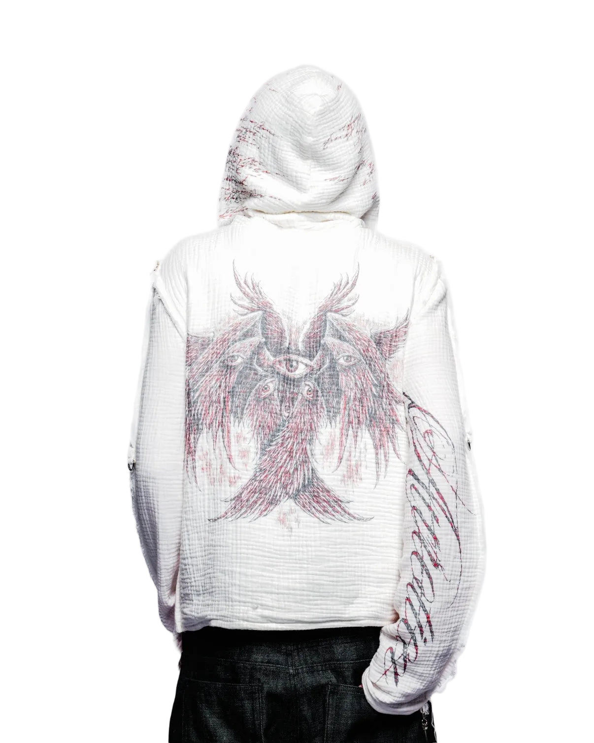 Person wearing a white hoodie with a pink eagle design on the back against a white background